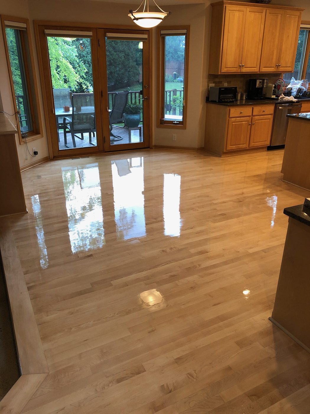 Hardwood kitchen floor with extraordinary reflective shine