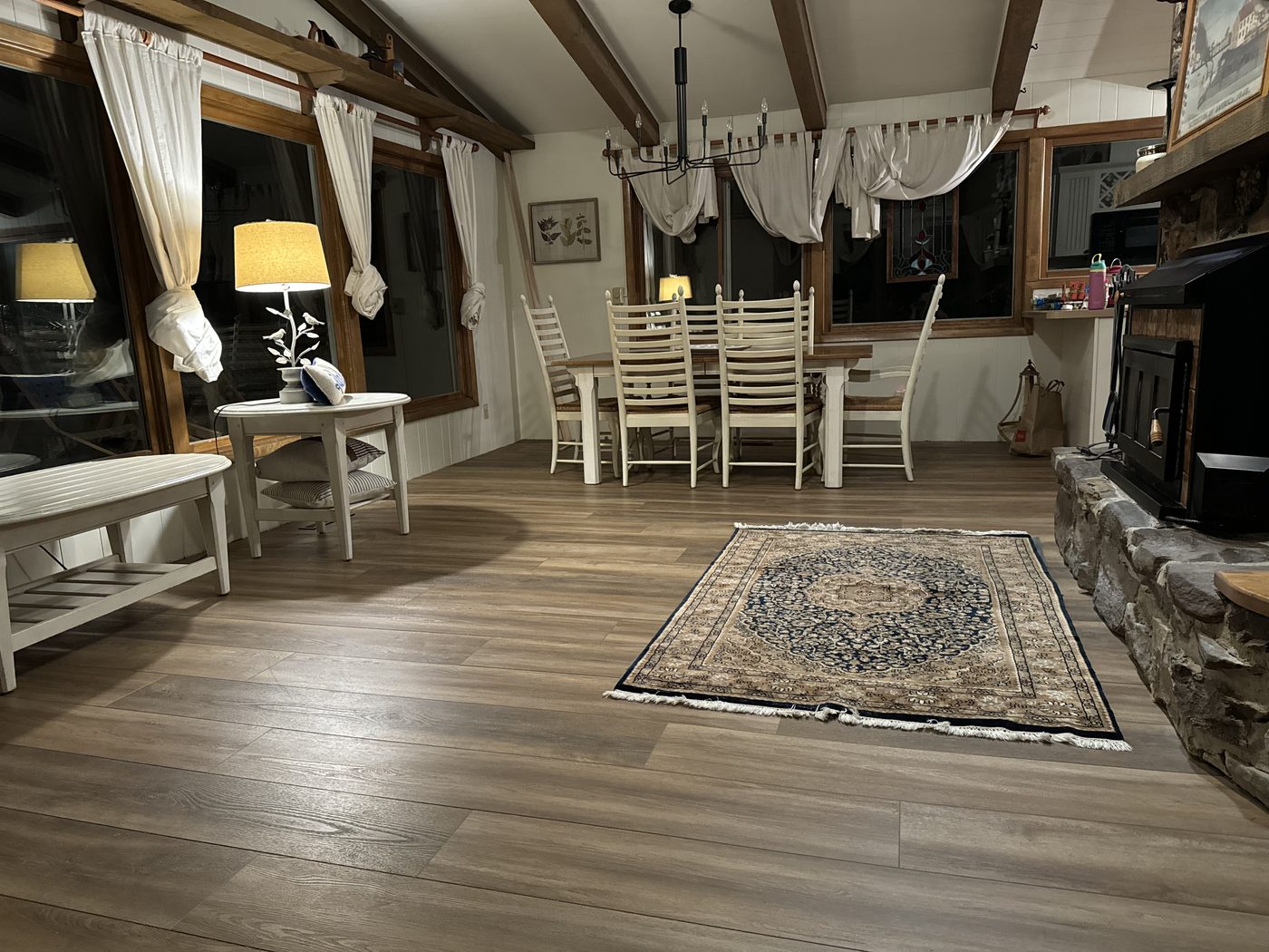 LVP flooring in elegantly furnished open-concept great room